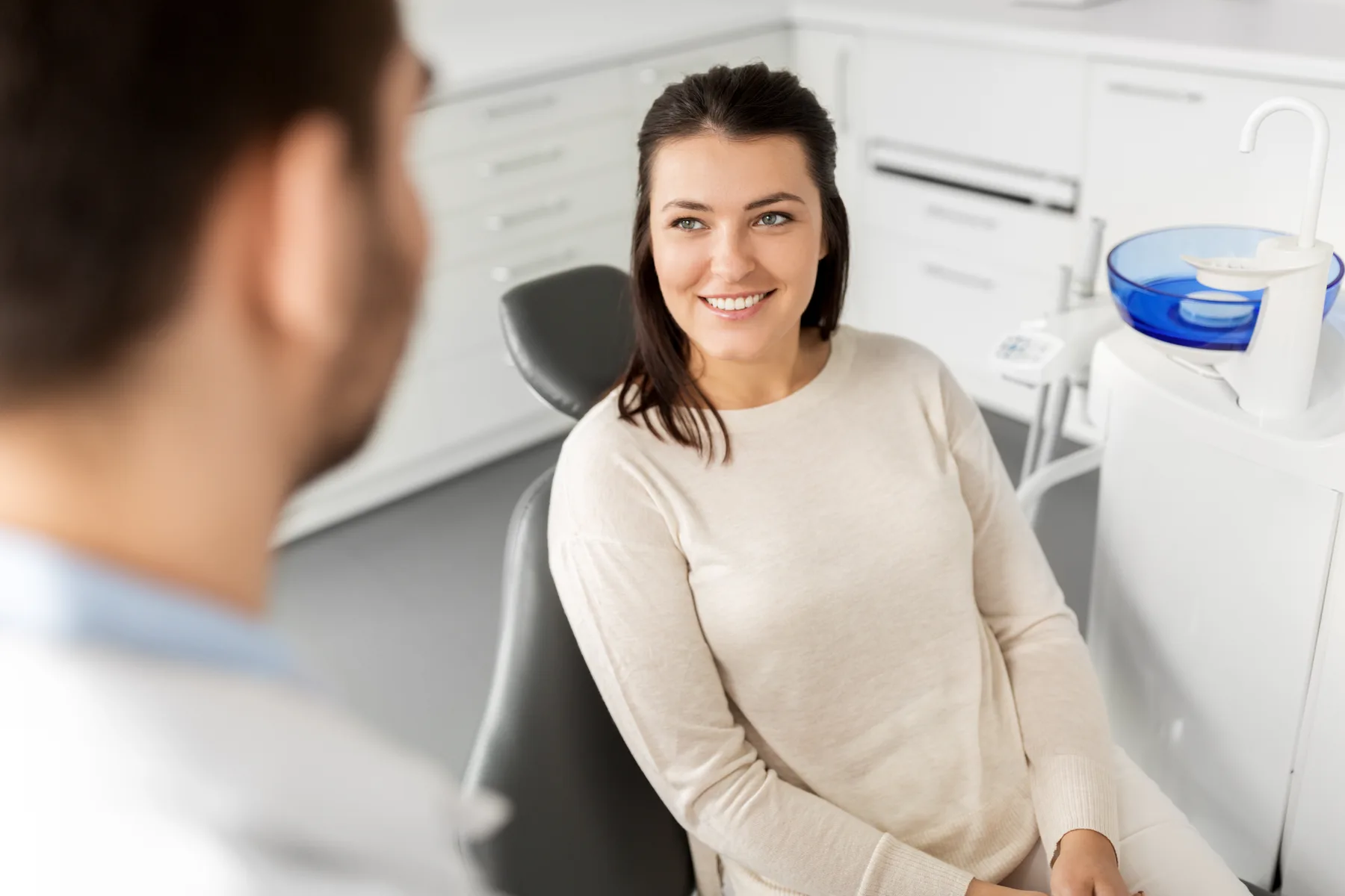 A patient speaking with a dentist