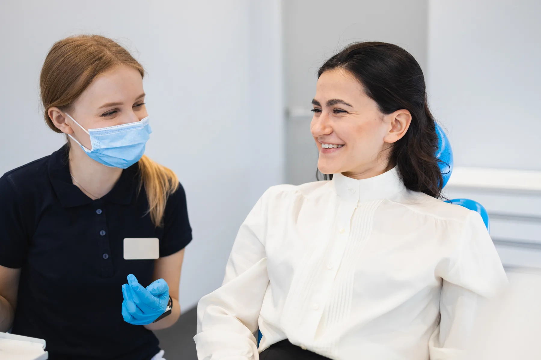 A patient talking with a dental professional