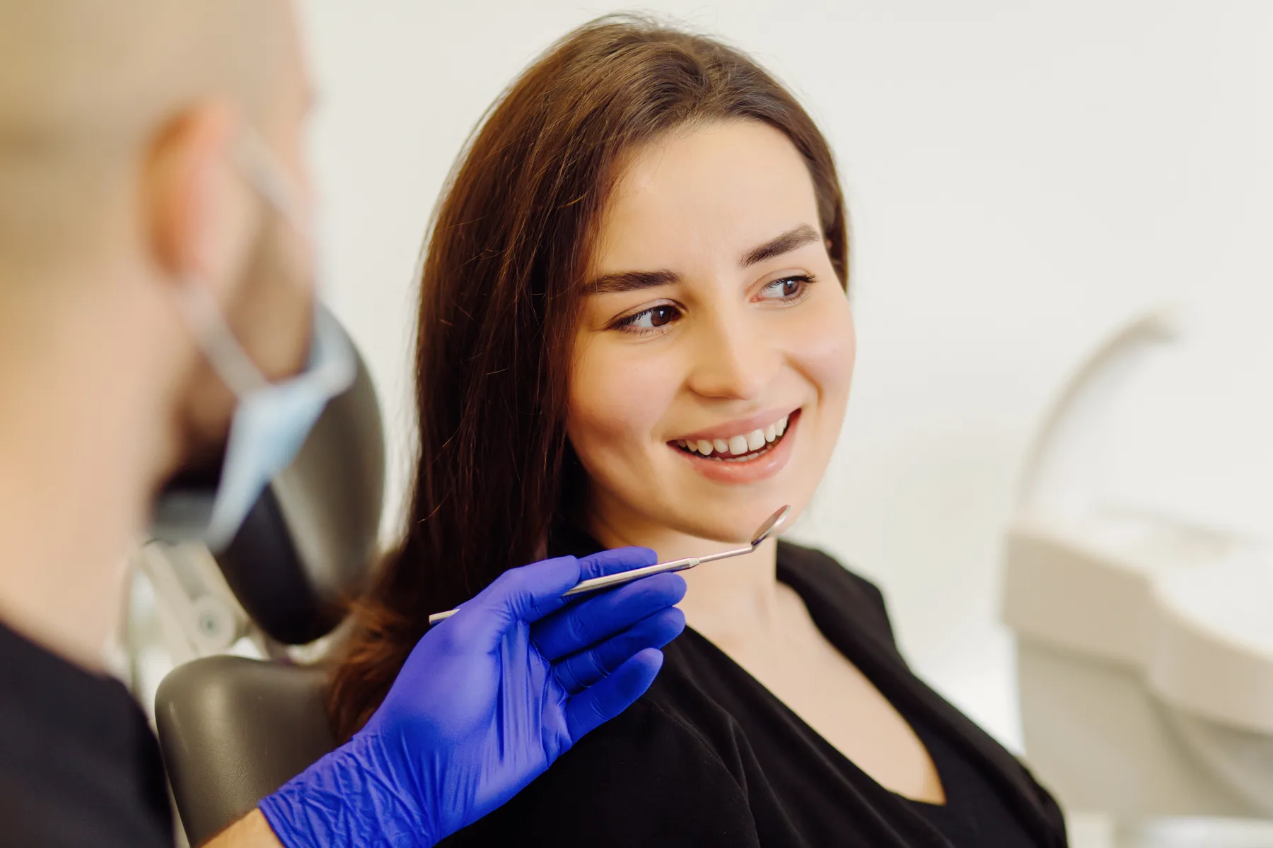 A patient discussing tooth shades with a dentist